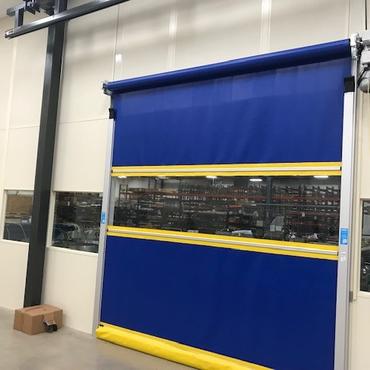 Blue and yellow high speed roll up door with windows.